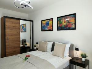 Łóżko lub łóżka w pokoju w obiekcie Modern Apartment