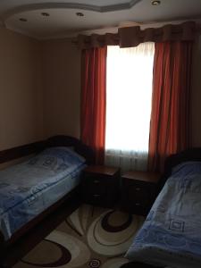 Postel nebo postele na pokoji v ubytování Hotel Oktan