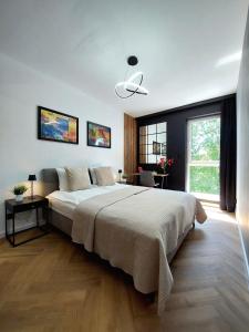 Łóżko lub łóżka w pokoju w obiekcie Modern Apartment