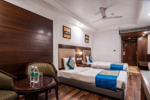 Postel nebo postele na pokoji v ubytování Hotel Le Roi Near New Delhi Railway Station