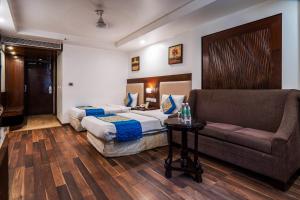 Postel nebo postele na pokoji v ubytování Hotel Le Roi Near New Delhi Railway Station