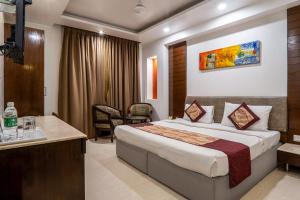 Postel nebo postele na pokoji v ubytování Hotel Le Roi Near New Delhi Railway Station