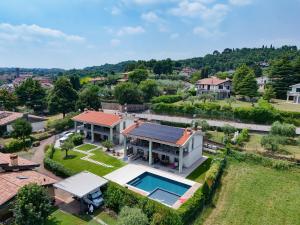 an aerial view of a house with a swimming pool at Gardaliva 5 in Manerba del Garda