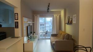 Μια τηλεόραση ή/και κέντρο ψυχαγωγίας στο P15 - Varanda Gourmet, 100m do mar -2 Vagas de garagem - Petfriendly