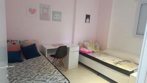 Ένα ή περισσότερα κρεβάτια σε δωμάτιο στο P15 - Varanda Gourmet, 100m do mar -2 Vagas de garagem - Petfriendly