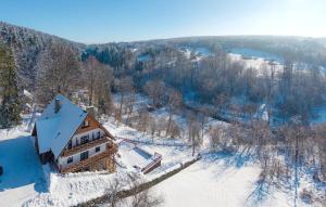 an aerial view of a house in the snow at Tarninowe Wzgórze in Kunkowa