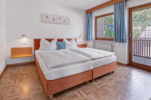 Postel nebo postele na pokoji v ubytování New Residence Schnatzhof Schlanders + 218 fotografií