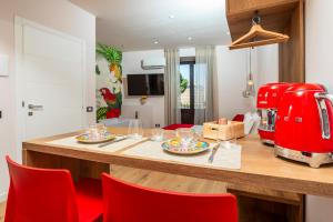 a kitchen with a red coffee machine on a counter at Luxury Fire Home - Catania in Catania