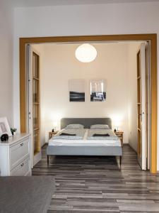 a bedroom with a large bed in a room at Chic Asboth City Center Loft - Perfect Location in Budapest