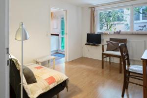 TV a/nebo společenská místnost v ubytování Gästehaus Henke