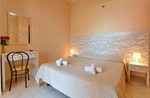 Postel nebo postele na pokoji v ubytování Hotel Costa d'Oro