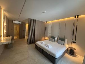 a bedroom with a large bed in a room at Tuck Inn in Larnaca