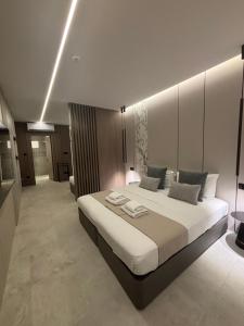 a bedroom with a large bed in a room at Tuck Inn in Larnaca