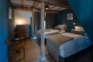 Postel nebo postele na pokoji v ubytování Design farmhouse in the countryside + 29 fotografií