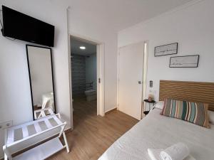 Postel nebo postele na pokoji v ubytování VMC Rooms