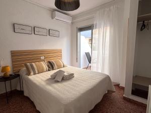 Postel nebo postele na pokoji v ubytování VMC Rooms
