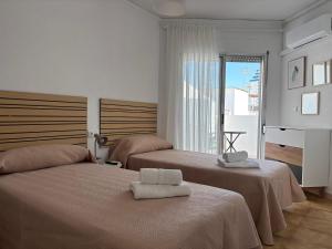 Postel nebo postele na pokoji v ubytování VMC Rooms