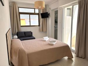 Postel nebo postele na pokoji v ubytování VMC Rooms