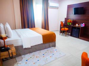 Voodi või voodid majutusasutuse Hôtel KEMAKA toas