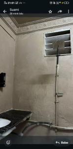 a sink in a room with a sink at DAYANG HOMESTAy in Semporna +51 photos