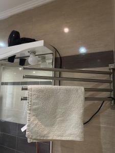 a towel hanging on a towel rack in a bathroom at Main Seaview apartment Orikum in Orikum +18 photos