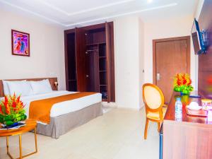 Voodi või voodid majutusasutuse Hôtel KEMAKA toas