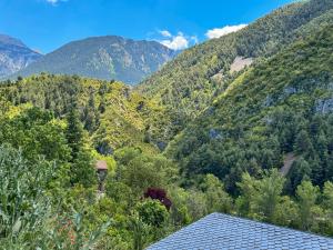 a view of the mountains from a house at Refugio Ceretà Naturaleza, Aventura y Confort in Alp +18 photos