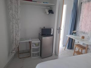 TV i/ili multimedijalni sistem u objektu Petit coin de paradis