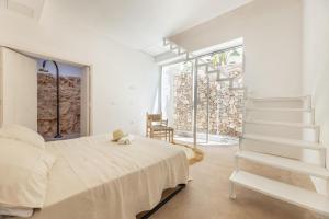 Giường trong phòng chung tại Villa Perla del Sud
