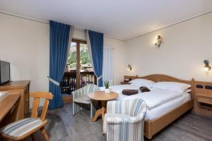 Posteľ alebo postele v izbe v ubytovaní Hotel Flora