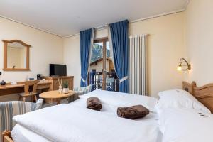 Posteľ alebo postele v izbe v ubytovaní Hotel Flora