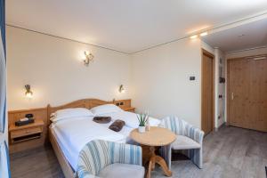 Posteľ alebo postele v izbe v ubytovaní Hotel Flora