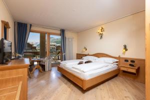 Posteľ alebo postele v izbe v ubytovaní Hotel Flora