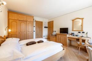 Posteľ alebo postele v izbe v ubytovaní Hotel Flora
