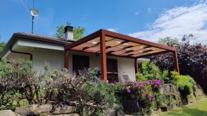 a house with a pergola on top of it at Villa Cubetto in Santa Lucia di Roversano