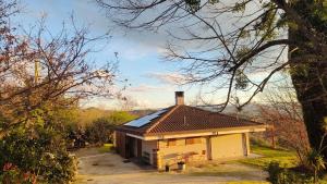a small house with a roof on top of it at Villa Cubetto in Santa Lucia di Roversano