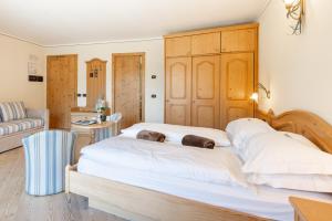 Posteľ alebo postele v izbe v ubytovaní Hotel Flora