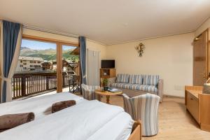 Posteľ alebo postele v izbe v ubytovaní Hotel Flora
