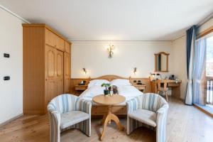 Posteľ alebo postele v izbe v ubytovaní Hotel Flora