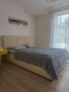 Giường trong phòng chung tại Apartament Nadmorski