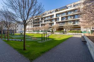 a park in front of a large building at Slnecnice studio with parking and 24 hour check in in Bratislava