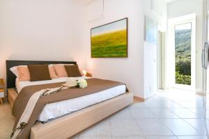 En eller flere senge i et værelse på Gargar home Sorrento