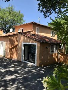 a house with a driveway in front of it at Studio - les Adrets Esterel in Fréjus