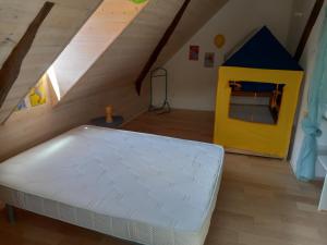 a room with a bed and a play house at Maison de maître in Argelès-Gazost +21 photos