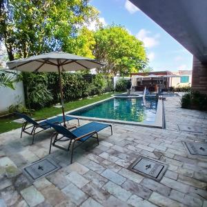Πισίνα στο ή κοντά στο Acolhedor Flat em Tamandaré