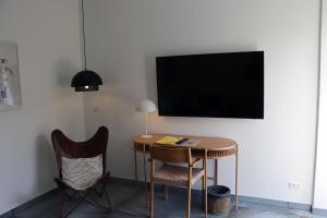 TV a/nebo společenská místnost v ubytování Hotel Petite B&B