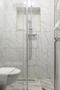 a bathroom with a glass shower with a toilet at Hotel Palas Grand View in Iaşi +208 photos