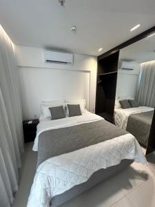 Giường trong phòng chung tại Flat em Ipojuca - Porto Alto GAV Resort