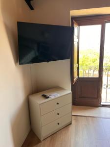 TV a/nebo společenská místnost v ubytování Vigna di pettineo - guest house