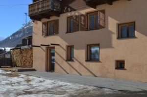 a building with windows on the side of it at Chalet Aura in Livigno